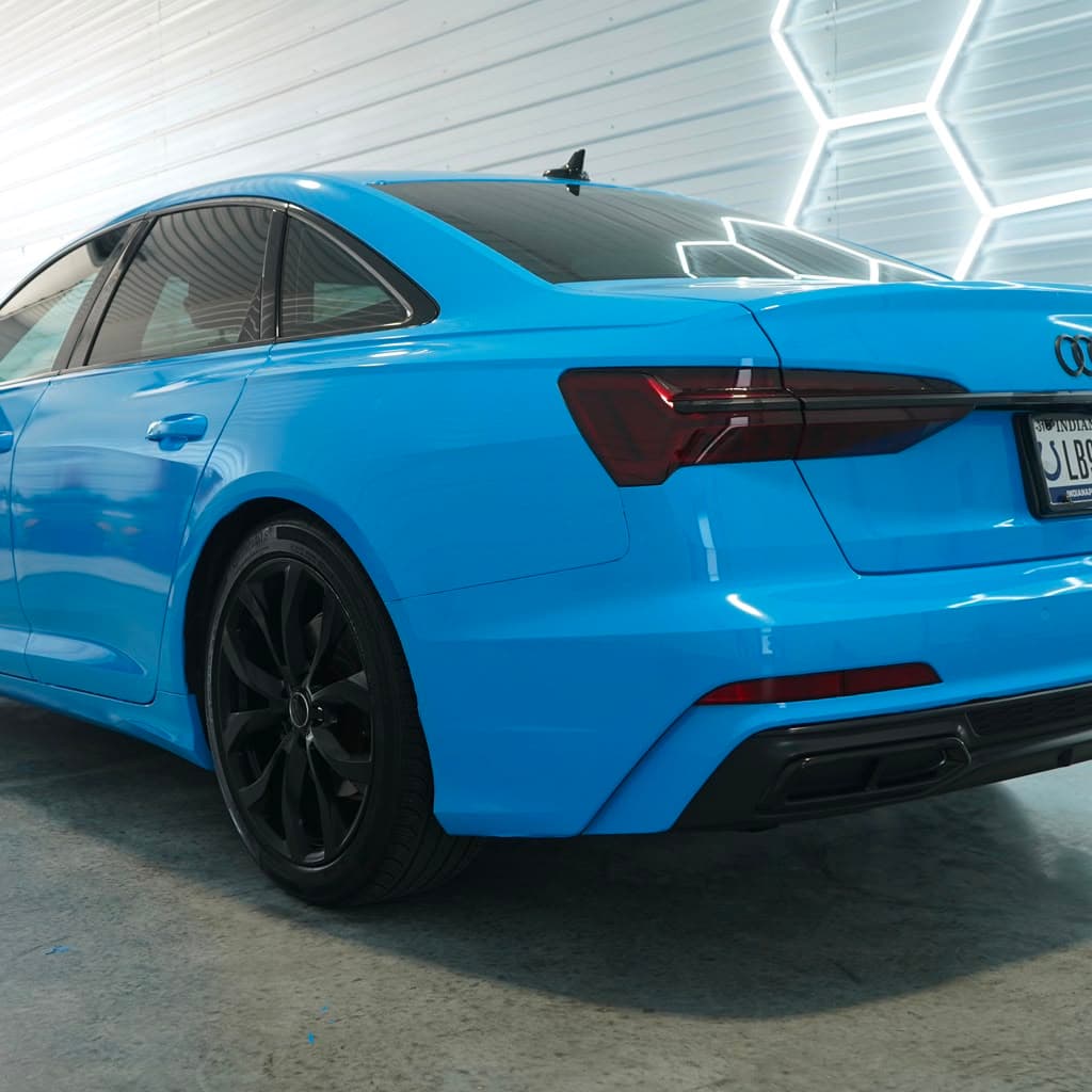 Finished Audi A6 rear three-quarter detail — bumper, taillight, and wheel finish